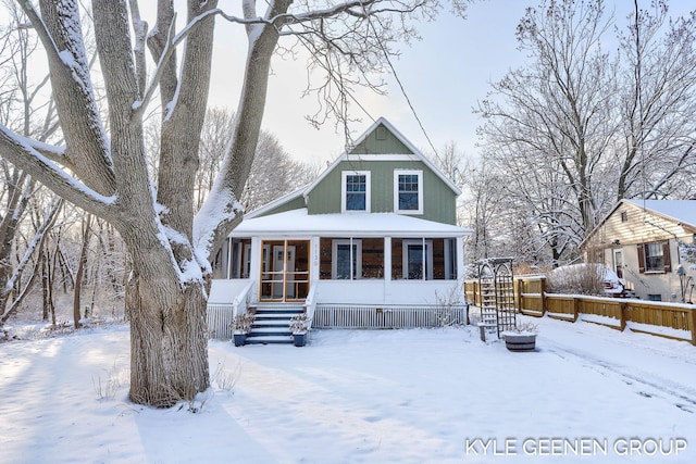 view of front of home featuring a sunroom