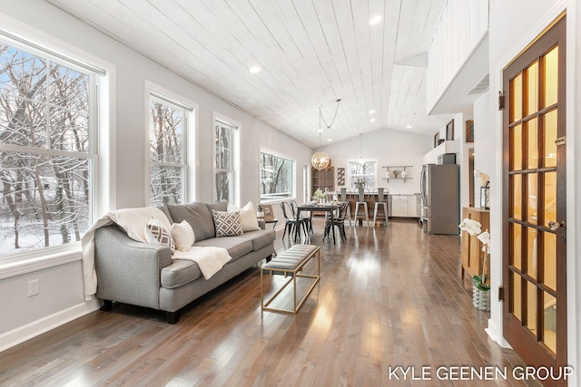 living room with hardwood / wood-style floors, a wealth of natural light, lofted ceiling, and wood ceiling