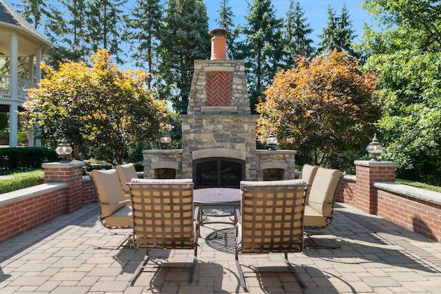 view of patio / terrace with an outdoor stone fireplace