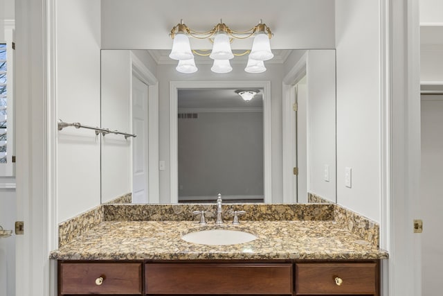 bathroom with vanity and crown molding