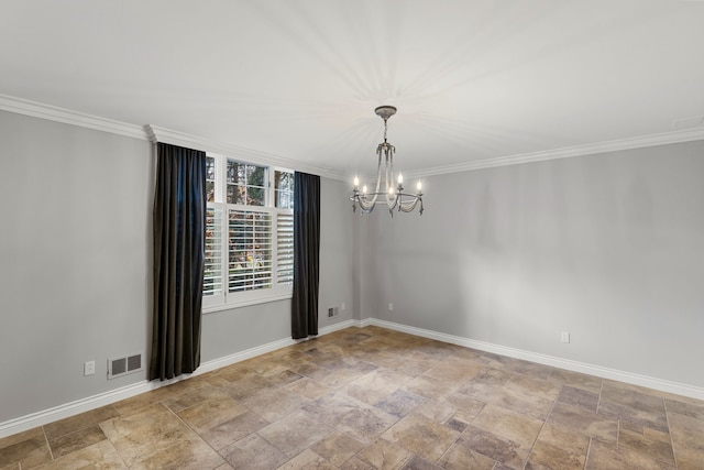 empty room with ornamental molding and an inviting chandelier