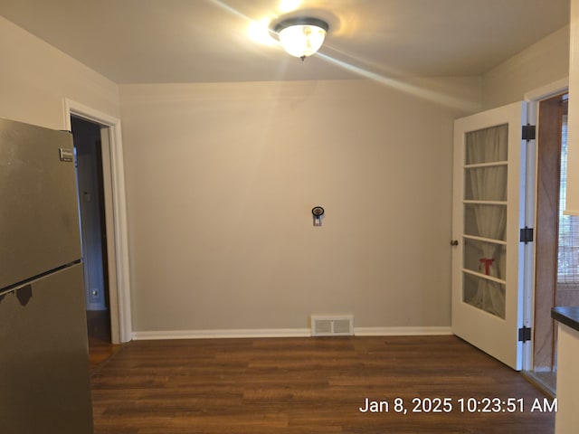 empty room featuring dark wood-type flooring