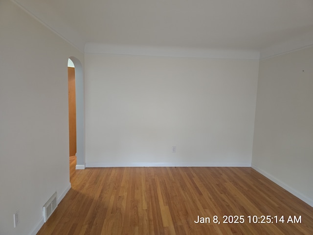 unfurnished room with light hardwood / wood-style floors