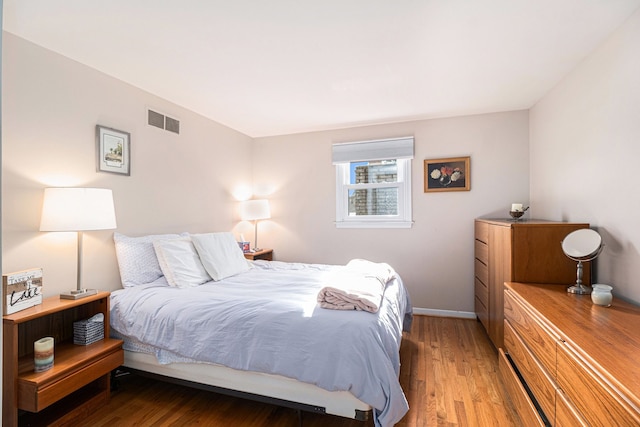 bedroom featuring hardwood / wood-style floors