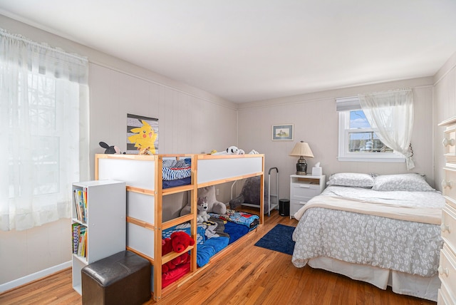 bedroom with hardwood / wood-style floors