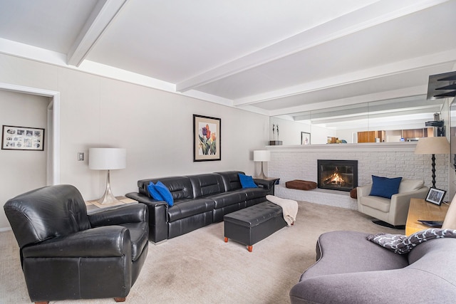 living room featuring carpet floors, beam ceiling, and a fireplace