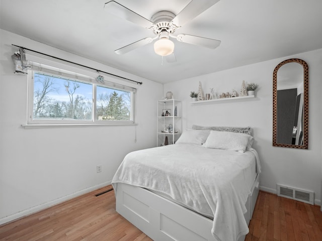 bedroom with ceiling fan and light wood-type flooring