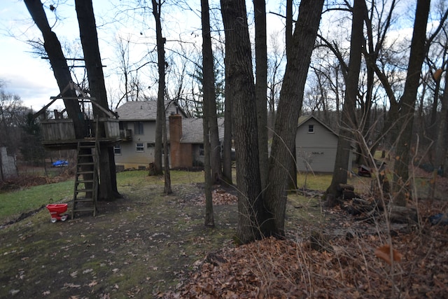 view of yard featuring a wooden deck