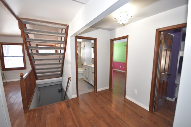 9417 Mabley Hill Rd, Fenton, MI 48430 - stairs featuring baseboards and wood finished floors