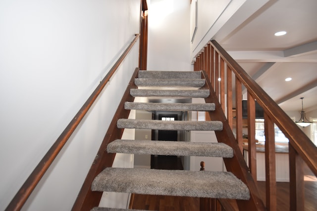 stairs with hardwood / wood-style flooring