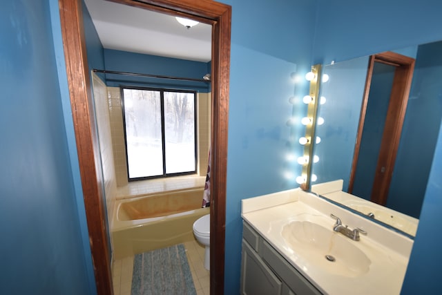 bathroom featuring toilet, tile patterned flooring, and vanity