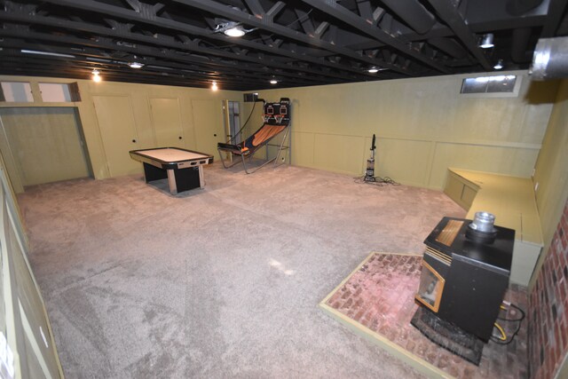 9417 Mabley Hill Rd, Fenton, MI 48430 - finished below grade area featuring a wood stove and carpet flooring