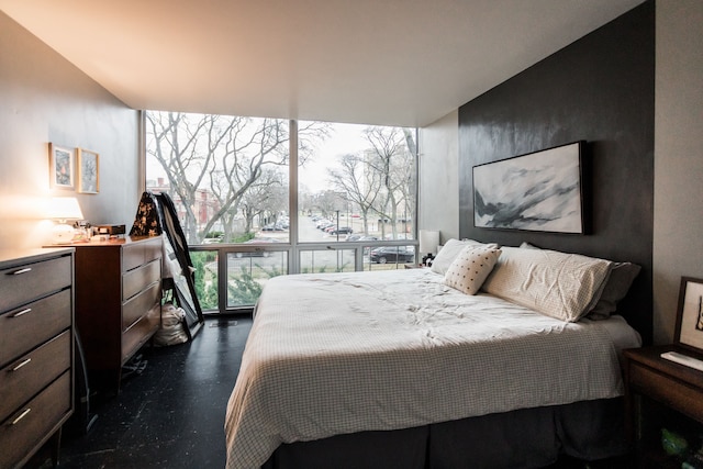 bedroom with a wall of windows