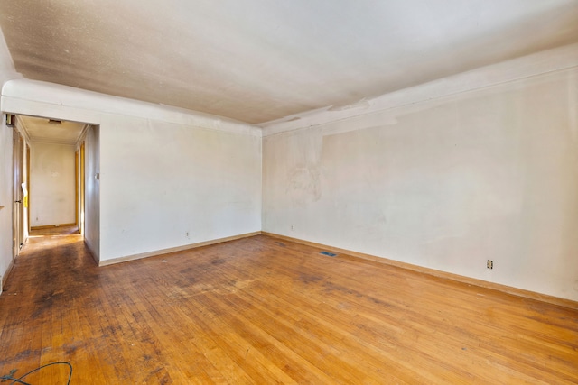 spare room featuring hardwood / wood-style flooring