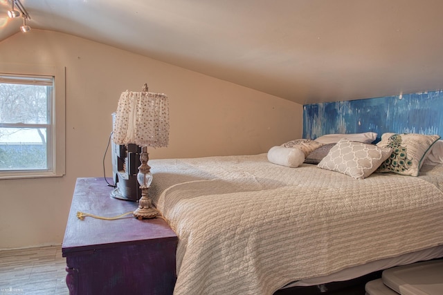 bedroom with vaulted ceiling