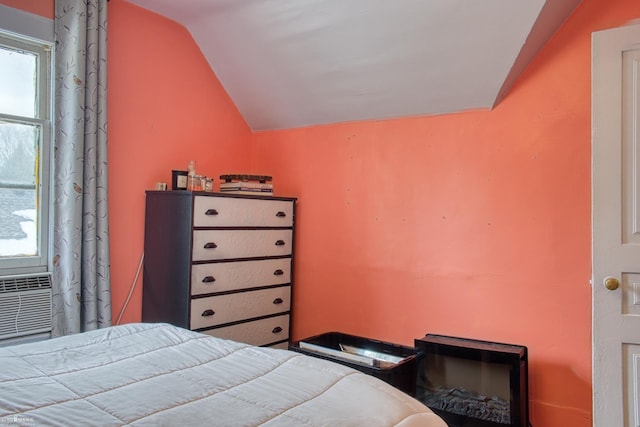 bedroom with lofted ceiling