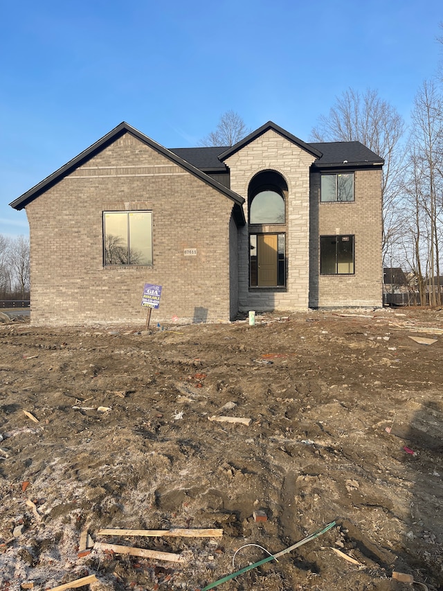 view of front of property featuring brick siding