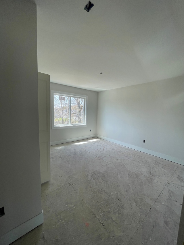 empty room with baseboards