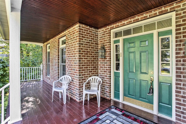 doorway to property featuring a porch