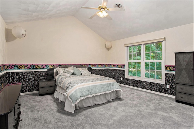 carpeted bedroom featuring vaulted ceiling and ceiling fan