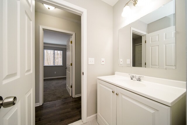 bathroom featuring wood-type flooring and vanity