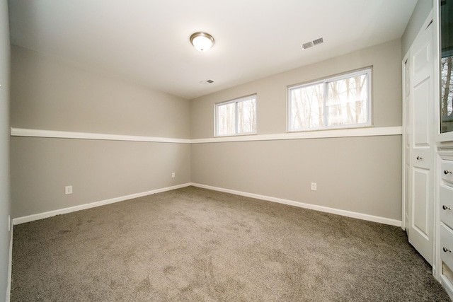 spare room with carpet