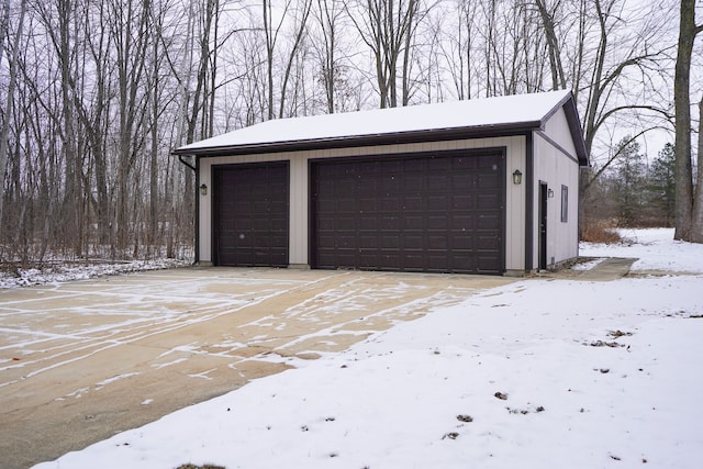 view of snow covered garage