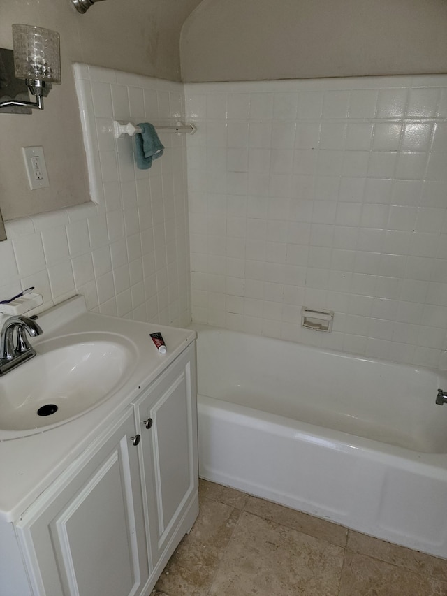 bathroom featuring vanity and decorative backsplash