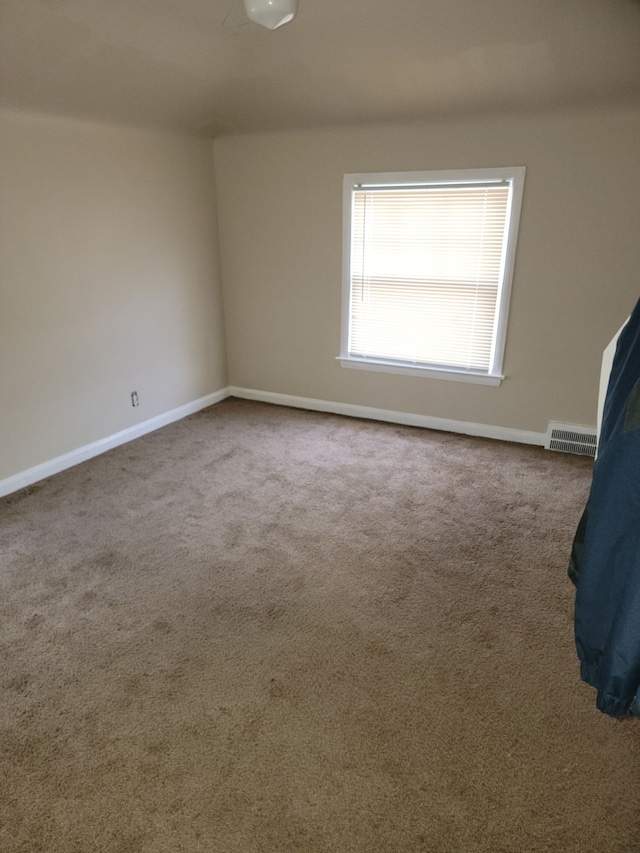 spare room with carpet