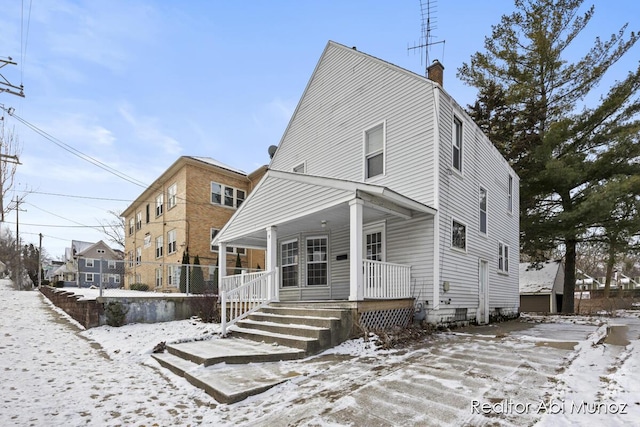 view of front of property featuring covered porch