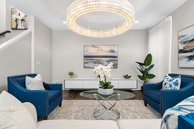 living room with hardwood / wood-style flooring and an inviting chandelier