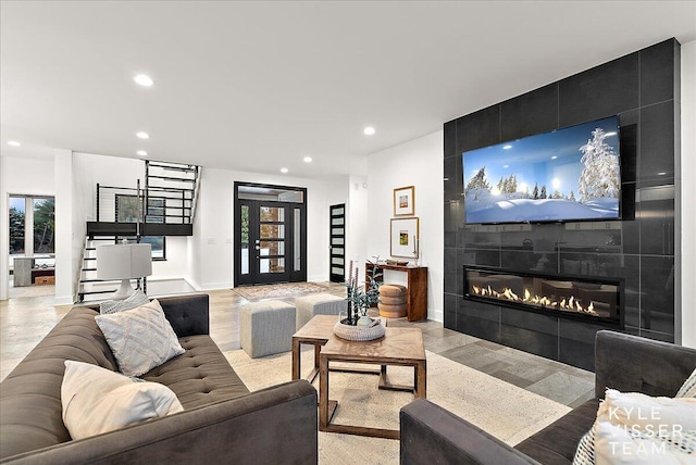 living room featuring a tile fireplace