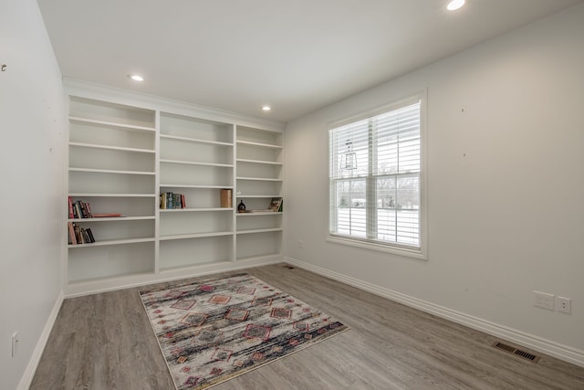 unfurnished room featuring hardwood / wood-style floors