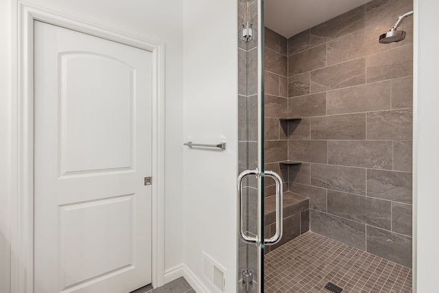 bathroom with a shower with shower door