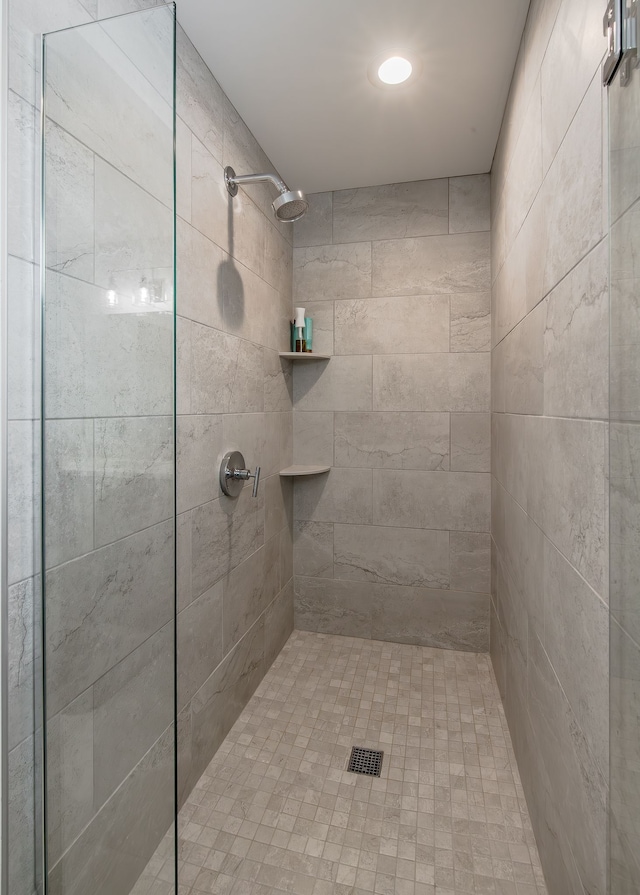 bathroom with tiled shower