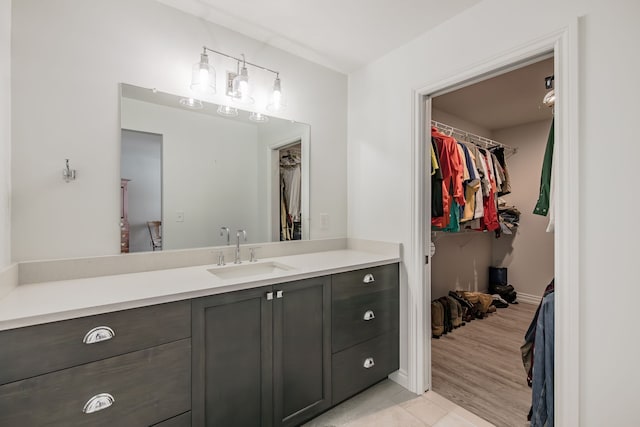 bathroom featuring tile patterned flooring and vanity