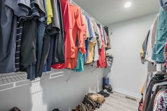 spacious closet featuring light wood-type flooring