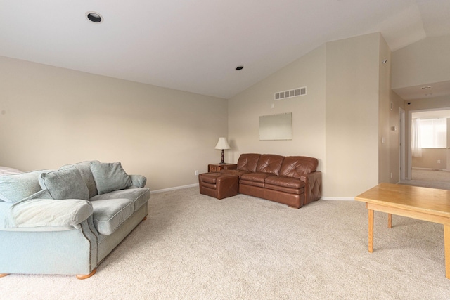 living room with light carpet and vaulted ceiling