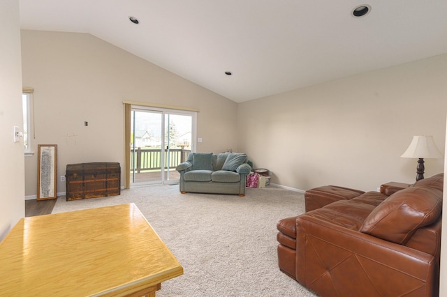 living room with carpet flooring and lofted ceiling