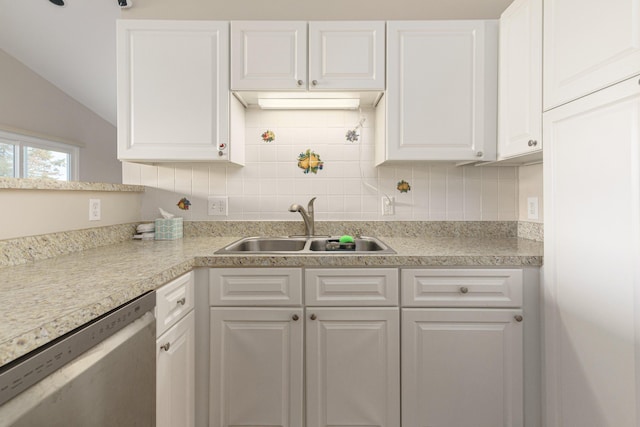 kitchen with backsplash, vaulted ceiling, sink, dishwasher, and white cabinetry