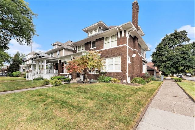 view of front of property with a porch and a front yard