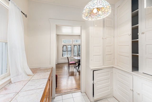 hallway with light tile patterned floors