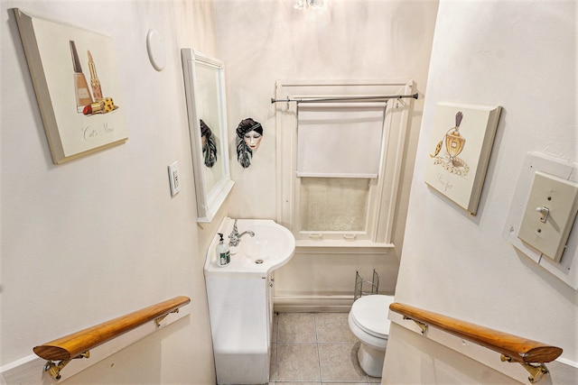 bathroom with tile patterned floors, toilet, and sink