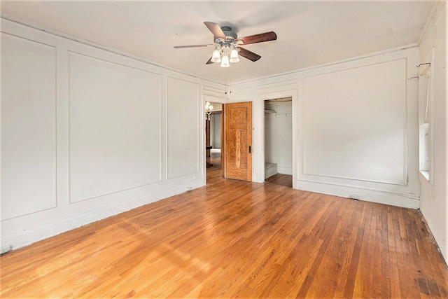 unfurnished bedroom with hardwood / wood-style floors and ceiling fan