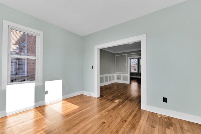 empty room with hardwood / wood-style floors