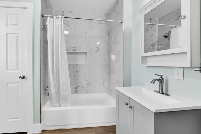 bathroom featuring vanity, wood-type flooring, and shower / bath combo with shower curtain