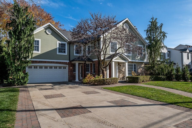 view of front facade featuring a front yard and a garage