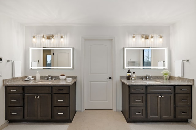 bathroom featuring tile patterned flooring and vanity