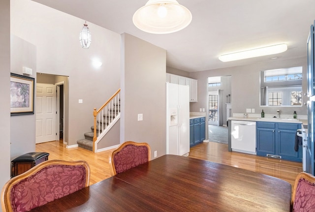 dining room featuring light hardwood / wood-style flooring and sink