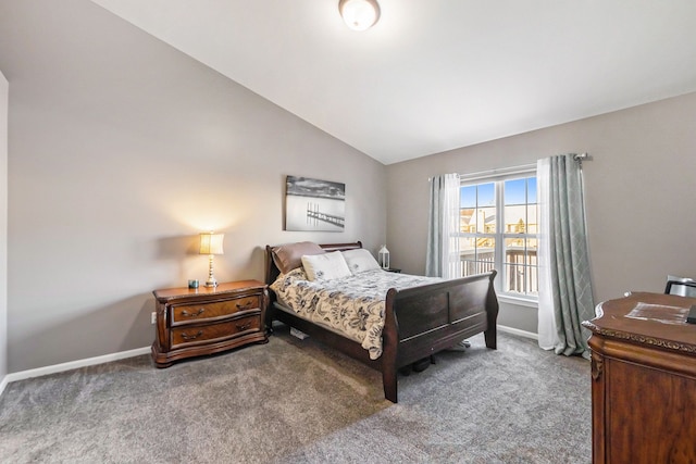 bedroom featuring carpet flooring and vaulted ceiling